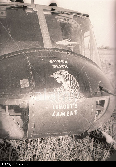 BGYRR8 A Huey helicopter of the 121st AHC in Soc Trang, Vietnam, has the words, "Super Slick," and, "Lamont's Lament," painted nose art. Image shot 1967. Exact date unknown.