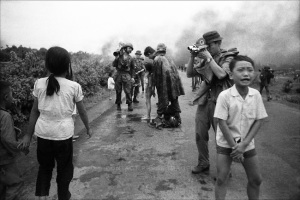 Journalists pour water over the burns of 9 year old Pham Thi Kim Phuc (center) who was injured in the accidental napalm bombing during a battle in Trang Bang. The iconic image by Nick Ut of Kim Phuc running was taken moments before this one. Trang Bang, South Vietnam, June 8, 1972