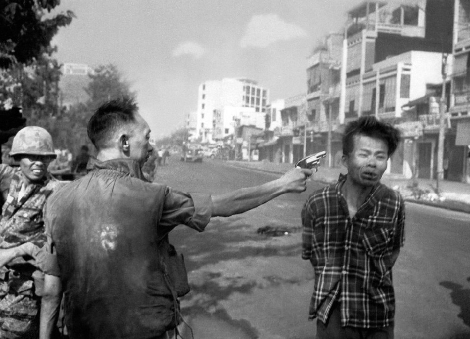 South Vietnamese Gen. Nguyen Ngoc Loan, chief of the national police, fires his pistol into the head of suspected Viet Cong officer Nguyen Van Lem, also known as Bay Lop, on a Saigon street, early in the Tet Offensive on Feb. 1, 1968. (AP Photo/Eddie Adams)