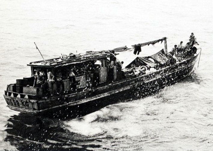 boat_with_refugees_during_operation_frequent_wind_in_1975