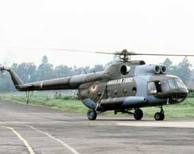 An Indian air force Mi-8 Hip helicopter rolls along a taxiway at an airport in Bangladesh. Indian, the U.S. and nations are sending aid to Bangladesh in response to the severe flooding in that country.